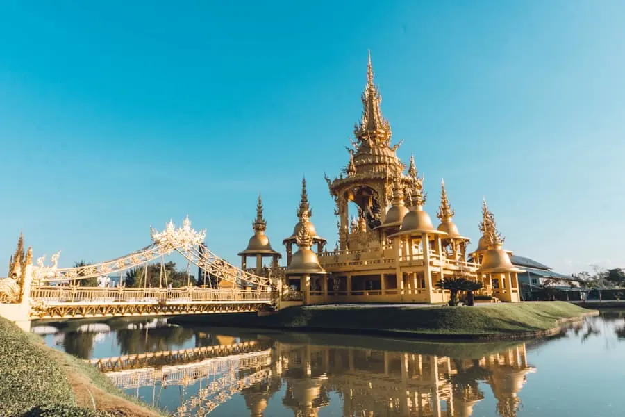 A gilded temple standing over water