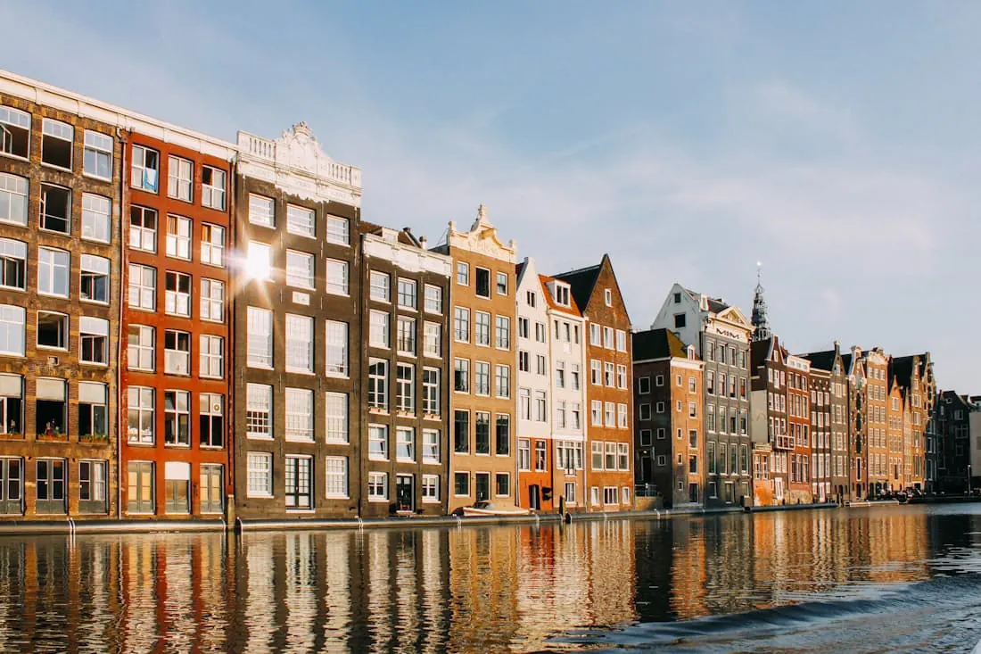 Coloured houses leaning over the water