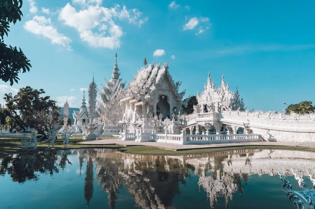 A pale temple beside still water
