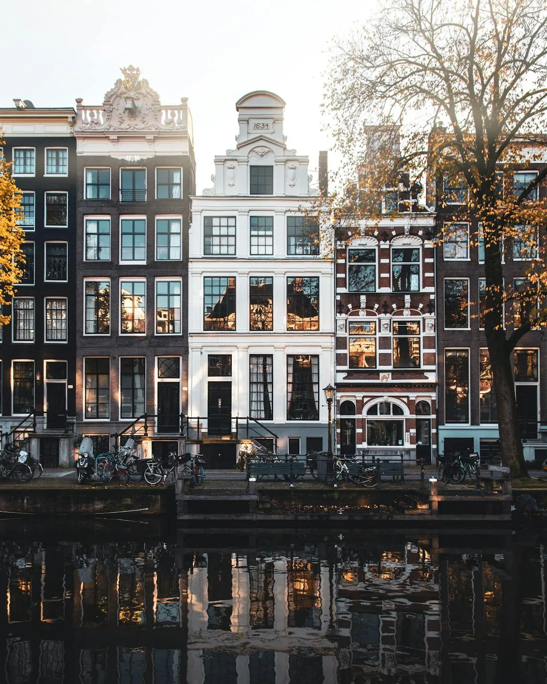 A pale facade above still water