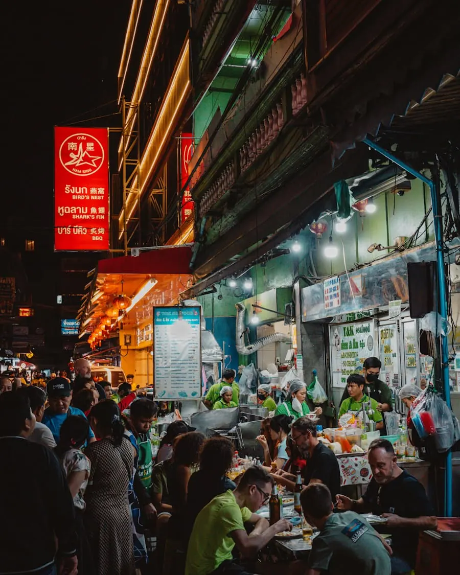 A table of people eating outside in the evening
