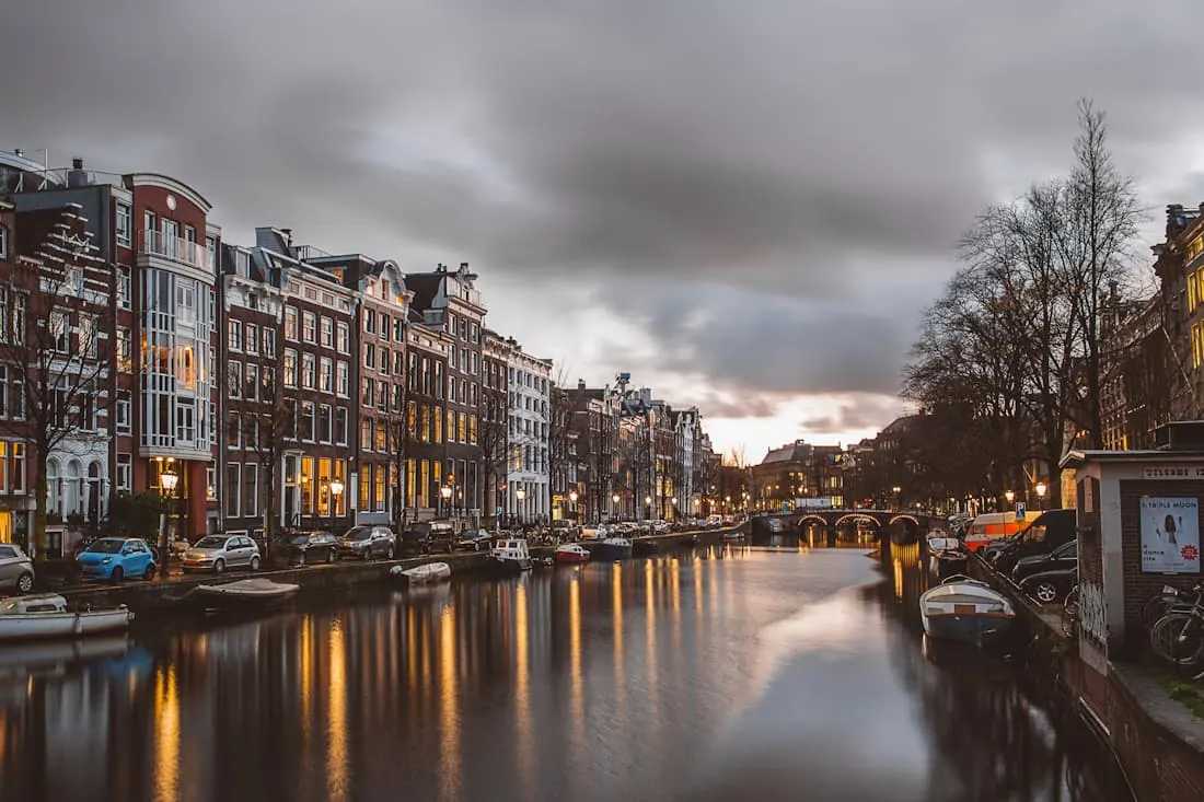 Rain falling on the canal at dusk